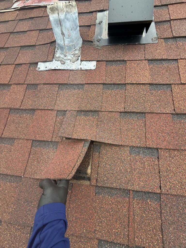 Shingles torn off a roof after a storm